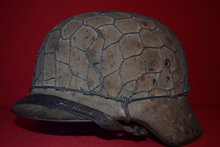 WW2 GERMAN M40 CAMO AND CHICKENWIRE HELMET.-SOLD